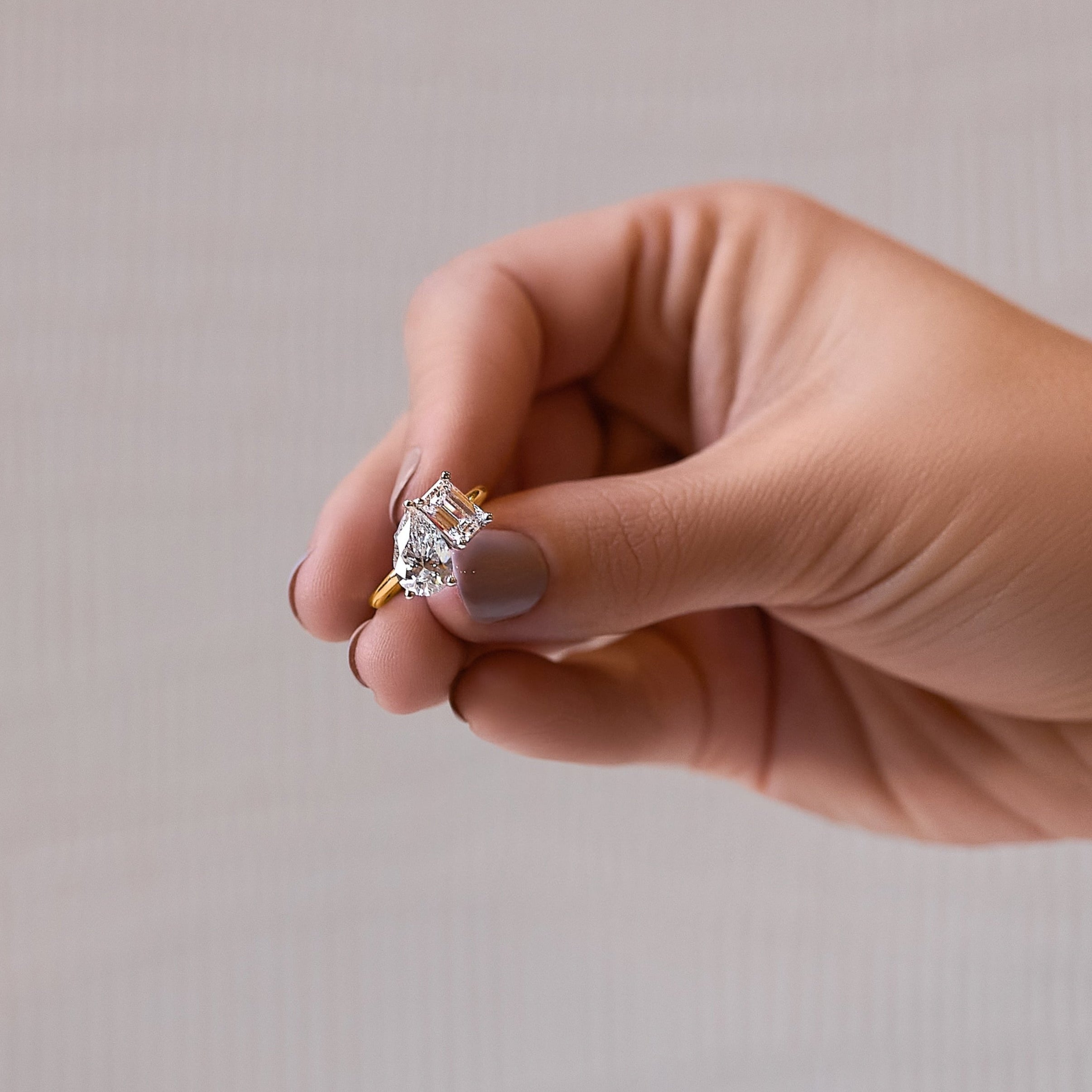 Toi et Moi 14K solid yellow gold pear cut and emerald cut diamond ring