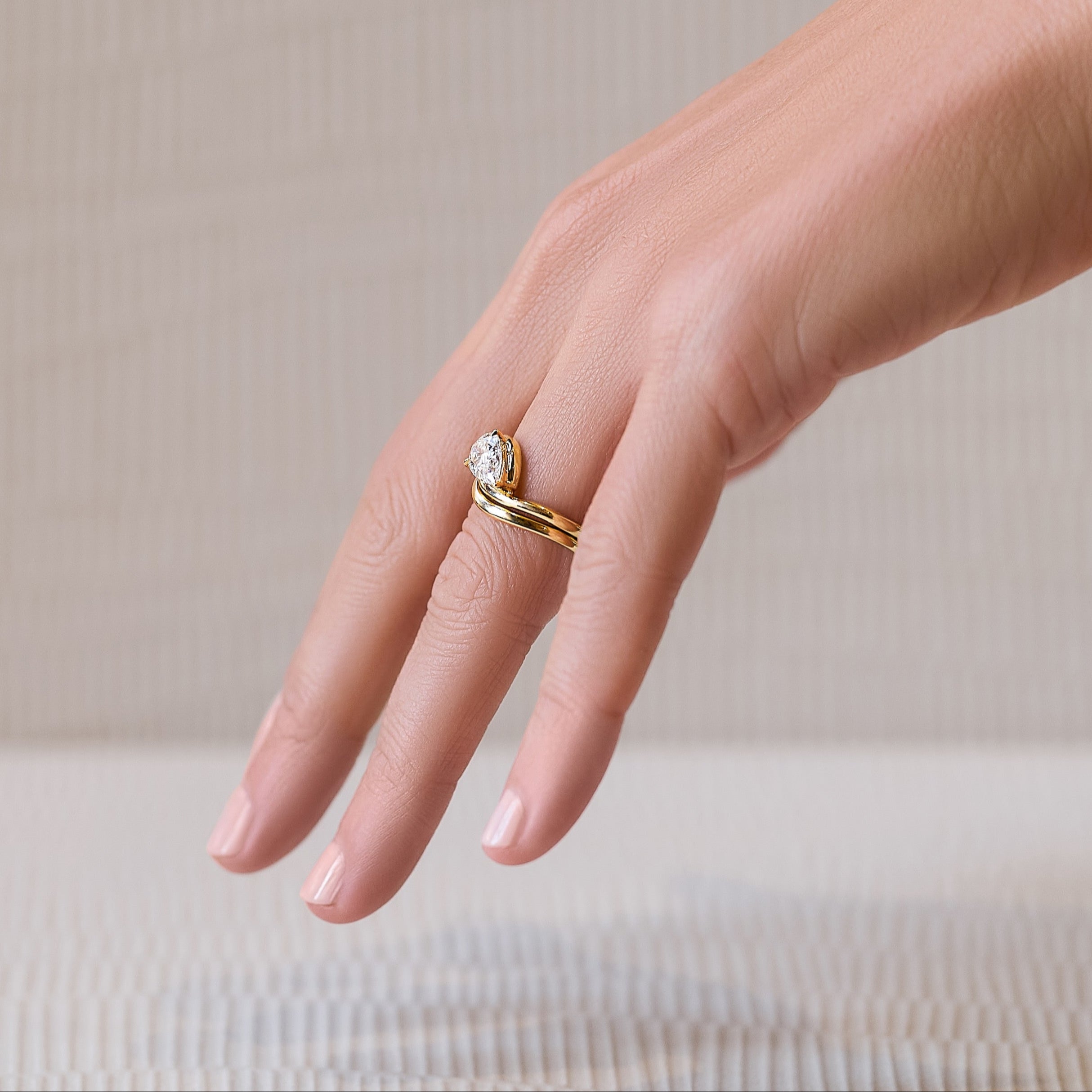 Eliana 14K solid yellow gold with pear-shaped diamond nesting ring and band set