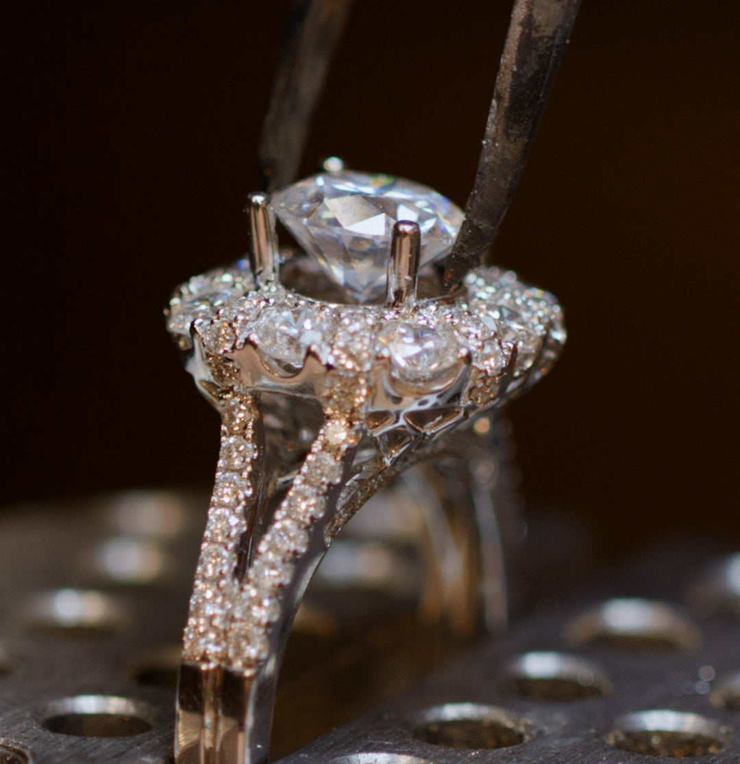 Diamond being placed inside a diamond cover silver ring